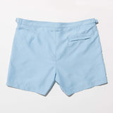 Tailored Swim Short - Sea in light blue, designed for versatile wear by the pool or city.