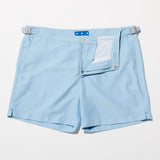 Tailored Swim Short - Sea in light blue color with a classic cut and adjustable waist features.