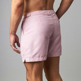 Man wearing tailored swim shorts European style in pink colour