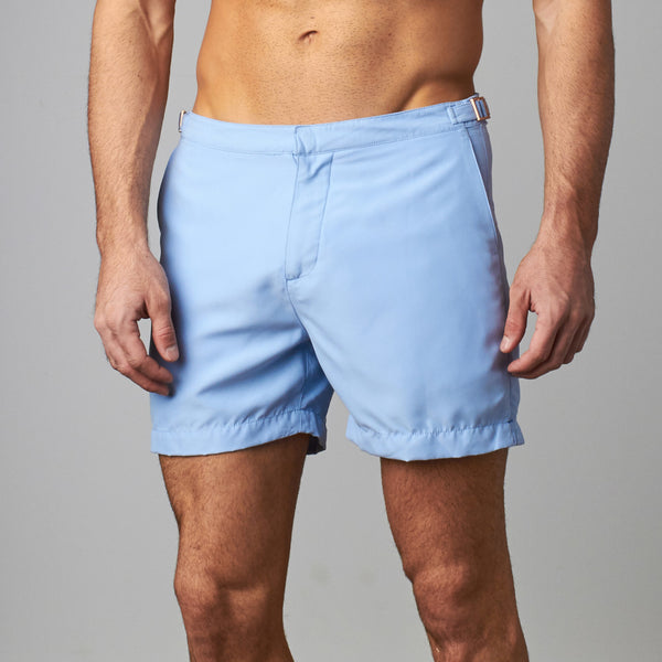 Man wearing tailored swim shorts European style in sky blue
